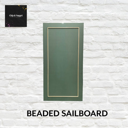 Beaded-sailboard-with-beading-detail-on-hinged-legs.png